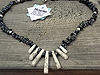 Snowflake Obsidian chips form the main body of the necklace with Howlite fan pieces in the centre. $30.00