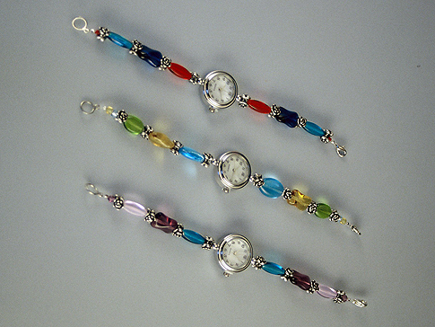 Left: Red & blue bead  Bracelet Watch $45.00 Middle: Aqua, brown & green beaded Bracelet Watch $45.00 Right: Light purple, Purple & Capri beaded Bracelet Watch $45.00